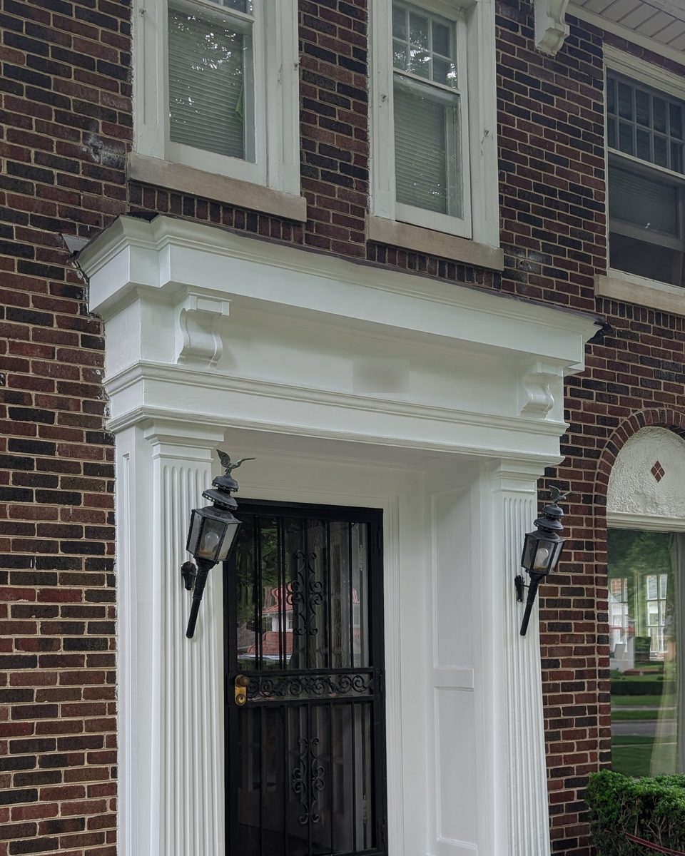 Entryway surround painted white, before repainting