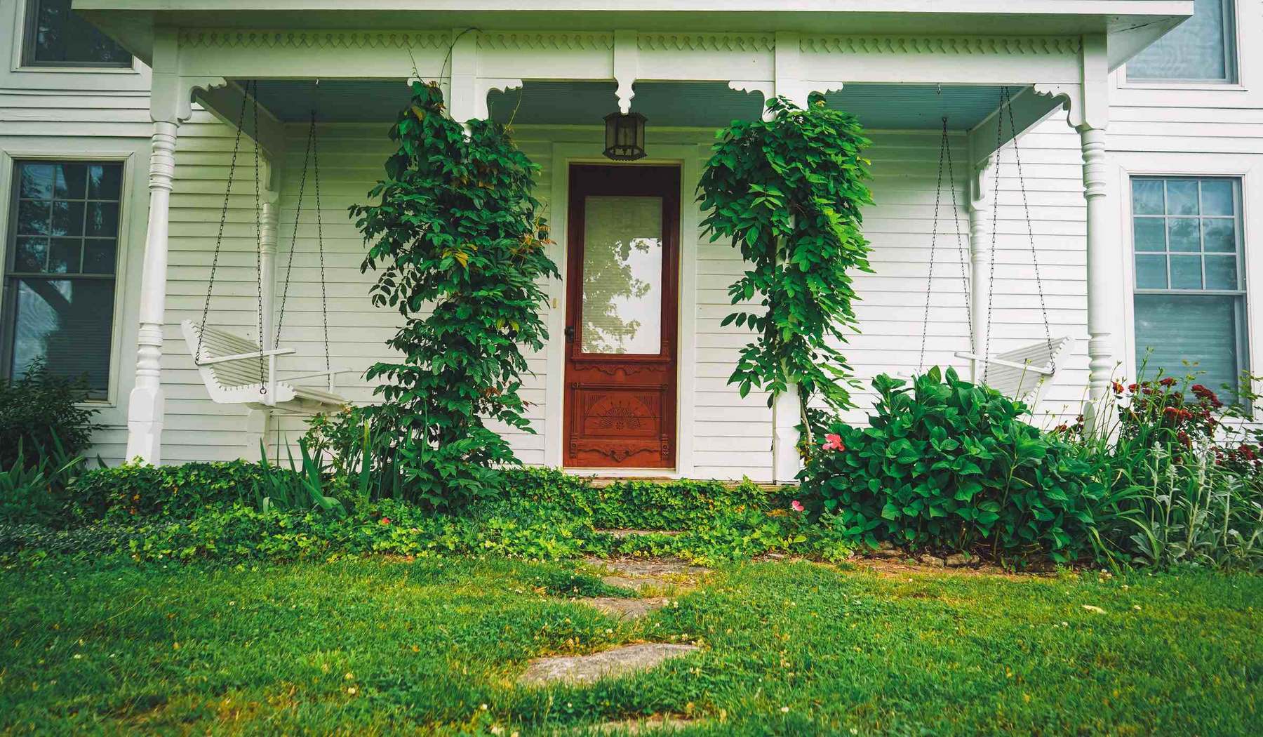 A welcoming front entryway with a stained wood door