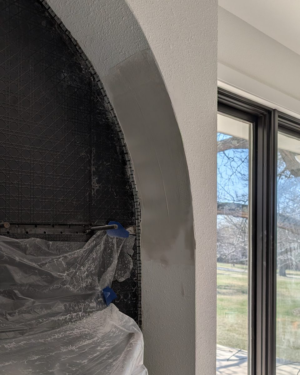 The same arch with backer board fitted and a metal arch bead being mudded